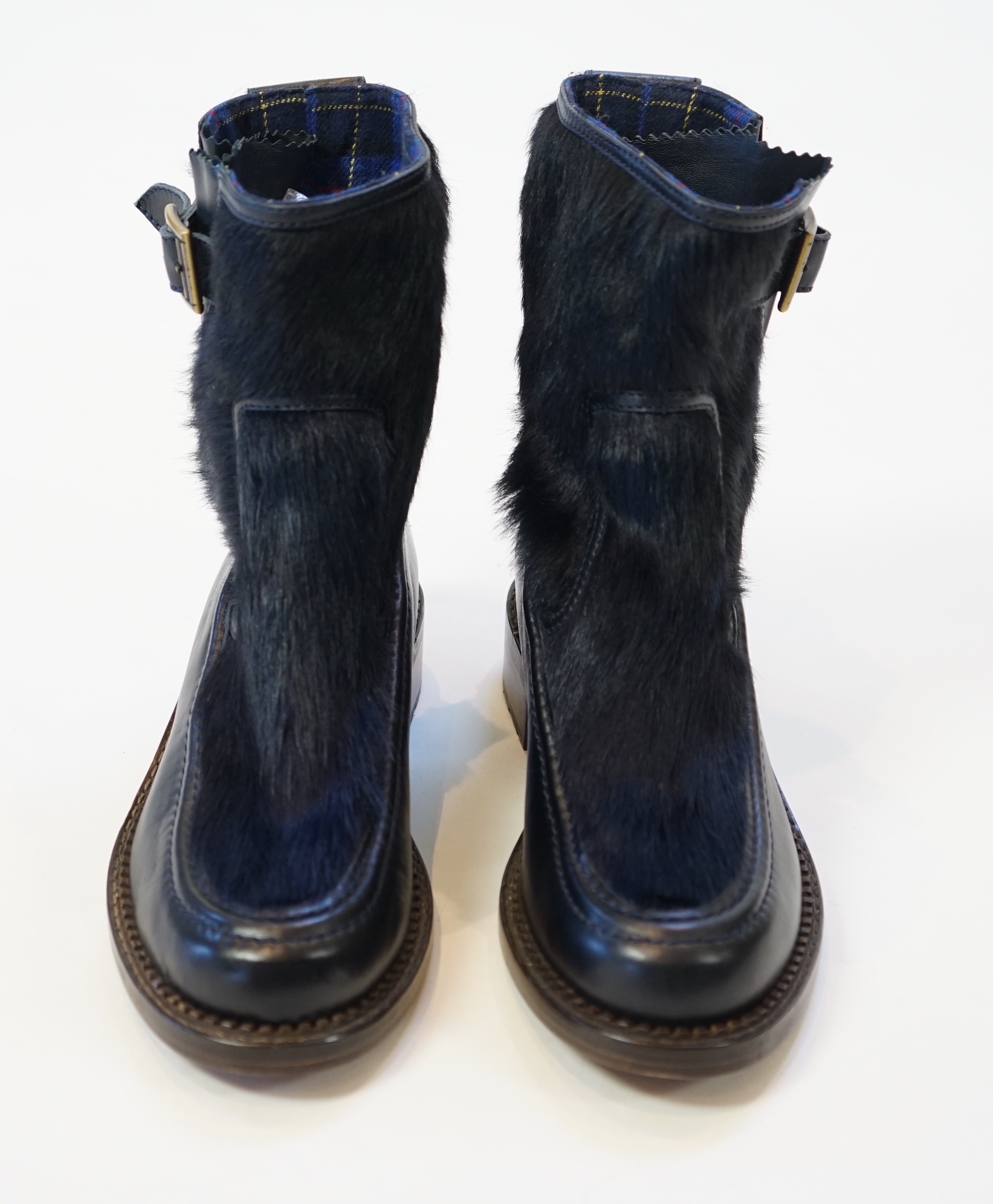 A pair of Chanel lady's navy blue leather calf hair pleated belted buckle boots, size EU 40.5